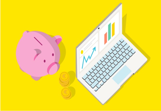 Piggy bank and laptop with financial charts